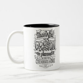Der Entwurfs-Handmit buchstaben gekennzeichnetes Zweifarbige Tasse