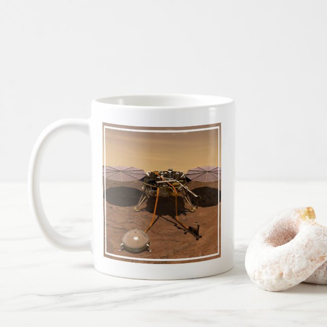 Der Erkennungsleuchter, der auf der Oberfläche von Kaffeetasse (Mit Donut)