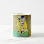 Der Kuss, Gustav Klimt Kaffeetasse<br><div class="desc">Gustav Klimt (14. Juli 1862 - 6. Februar 1918) war ein österreichischer symbolischer Maler und einer der prominentesten Mitglieder der Wiener Sezessionsbewegung. Klimt ist bekannt für seine Gemälde, Wandmalereien, Skizzen und andere Kunstgegenstände. Neben seinen figurativen Werken, die Allegorien und Portraits enthalten, malte er Landschaften. Unter den Künstlern der Wiener Sezession...</div>