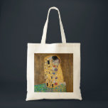 Der Kuss von Gustav Klimt Tragetasche<br><div class="desc">Der Kuss von Gustav Klimt Der Kuss ist ein Ölgemälde mit Goldblatt, Silber und Platin vom österreichischen Symbolik-Maler Gustav Klimt. Es wurde irgendwann in den Jahren 1907 und 1908 gemalt, auf dem Höhepunkt dessen, was Gelehrte seine "Goldene Periode" nennen. Mit schimmernden Goldtönen, stilisierten Formen und sentimentaler Ikonographie verzaubert der Kiss...</div>