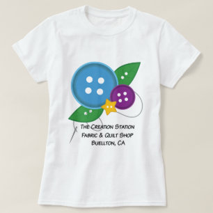 Der Schaffungs-Stations-Knopf-T - Shirt (blaue