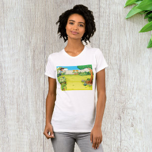 Der spielerische Junge, der in einem üppig grünen  T-Shirt