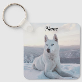 Der zauberhafte Weiße Husky-Hund im Schnee Schlüsselanhänger