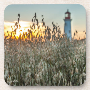 Dessous-de-verre d'un phare dans un champs