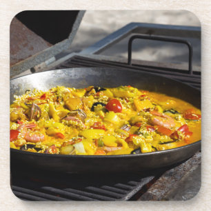 Dessous-de-verre La paella est cuite sur un grill