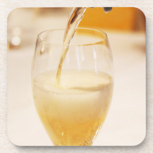 Dessous-de-verre Une flûte à champagne remplie de Gosset