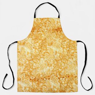 Detail aus Stoff mit goldenem Spitzen Schürze
