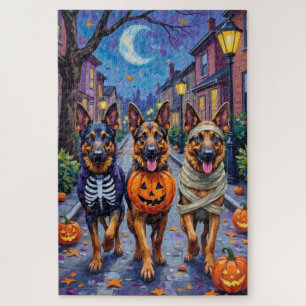 Deutsche Schäferhunde beim Halloween-Süßigkeiten-S