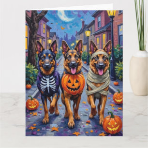 Deutsche Schäferhunde beim Halloween-Süßigkeiten-S Karte