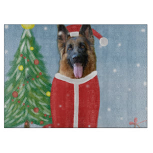 Deutscher Schäferhund im Schnee mit Weihnachtsgesc Schneidebrett