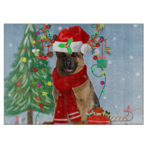 Deutscher Schäferhund im Schnee mit Weihnachtsgesc Schneidebrett