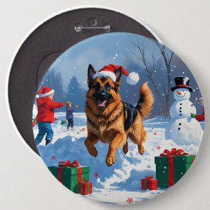 Deutscher Schäferhund läuft im Schnee mit Weihnach Button