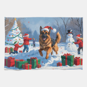 Deutscher Schäferhund läuft mit Weihnachtshut im S Geschirrtuch