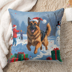 Deutscher Schäferhund läuft mit Weihnachtshut im S Kissen