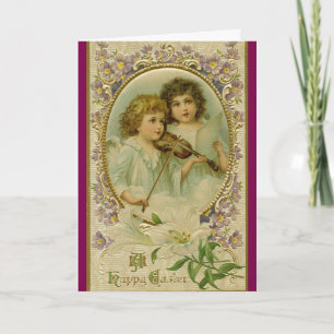 Deux anges avec carte de vacances de violon