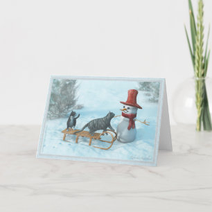 Deux chats et une carte de voeux Snowman