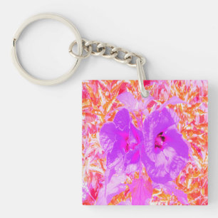 Deux Hibiscus de prune violet et rose chaud sur ro