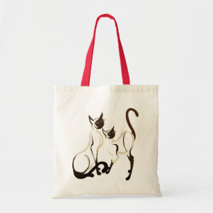 Deux sacs de chats siamois
