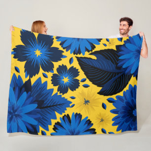 Dicke blaue Blüte auf lebhaftem gelben Hintergrund Fleecedecke