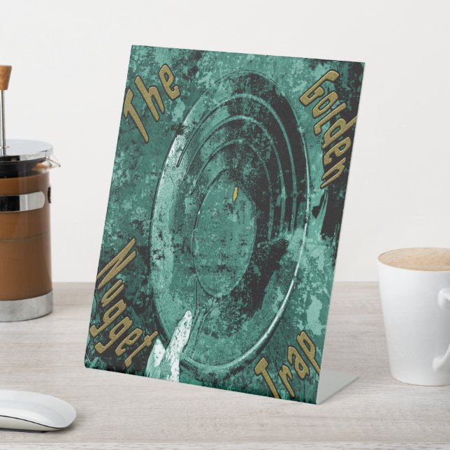 Die goldene Nugget-Falle Sockelschild (In SItu)