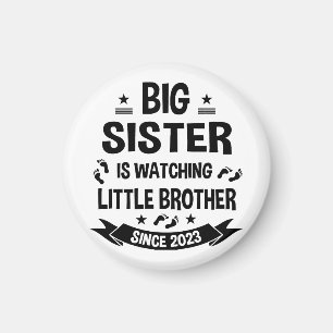 Die kleine Schwester kümmert sich um den großen Br Magnet