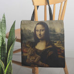 Die Meow Lisa Tasche<br><div class="desc">Die Meow Lisa Tote Tasche - Was ist der Grund für dieses mysteriöse Mona Lisa Lächeln? Auf den zweiten Blick haben wir die Antwort. Dieses absolute Meisterwerk einer Tüte zeigt das bekannteste Kunstwerk der Welt, "es wegzustecken" und eine gute Zeit mit einem Kätzchen zu haben. Egal, ob Sie Katzenliebhaber, Kunstbegeisterter...</div>
