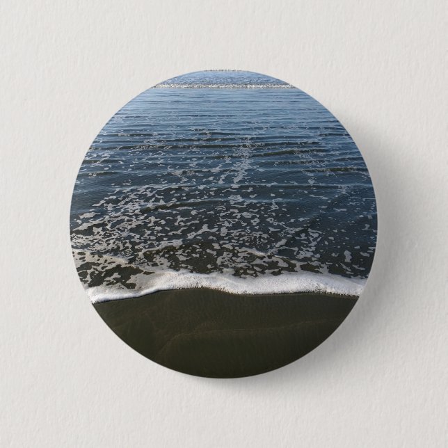 Die Ozeantide, die Ashore waschen Button (Vorderseite)