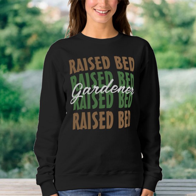 Die Pflanze, die den aufgehobenen Bettgärtner über Sweatshirt (Von Creator hochgeladen)