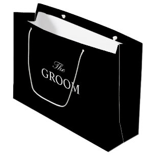 Die Schwarz-weiße Geschenktasche auf dem Boden Große Geschenktüte