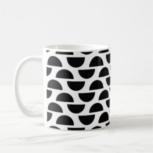 Die schwarzen Hälften des Kreises schaffen einen e Kaffeetasse