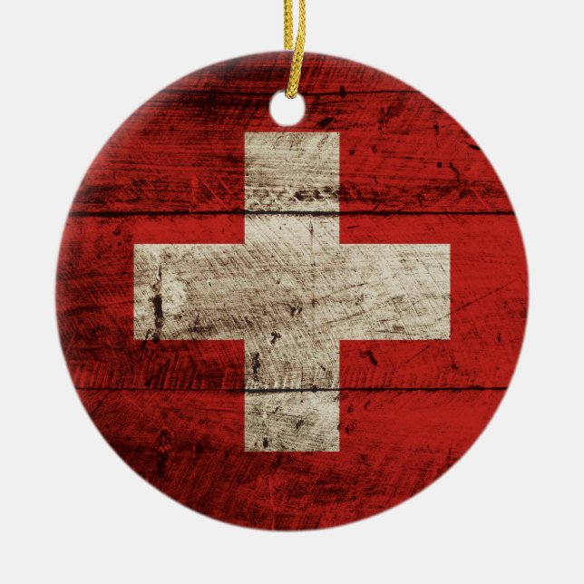 Die Schweiz-Flagge auf altem hölzernem Korn Keramikornament (Vorne)