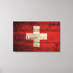 Die Schweiz-Flagge auf altem hölzernem Korn Leinwanddruck