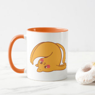 Die Tasse der Katze auf den Kopf