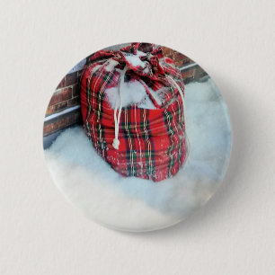 Die Weihnachtstasche im Schnee Button
