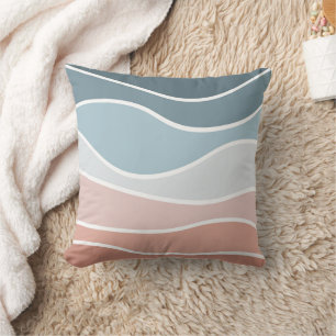 Die Wellen im Retrostil sind blau und rosa. Kissen