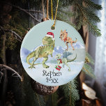 Dinosaur Christmas Tyrannosaur Raptor Keramik Ornament<br><div class="desc">Dieses Design kann in dem Bereich personalisiert werden, der durch das Ändern des Fotos und/oder Textes zur Verfügung gestellt wird. Sie können auch angepasst werden, indem Sie auf Vorlage personalisieren klicken und dann auf die Schaltfläche klicken, um weitere Optionen anzupassen, um die Hintergrundfarbe zu löschen oder zu ändern, Text hinzuzufügen,...</div>