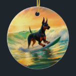 Doberman Beach Surfing Painting Keramik Ornament<br><div class="desc">Tauchen Sie ein in die spielerische Welt des Kaninchen-Abenteuers mit diesem faszinierenden Bild. Ein gepflegter Hund geht zu den Wellen und reitet geschickt auf einem sonnengeküssten Strand. Das lebendige Kunstwerk vereint wunderbar das Wesentliche der Erregung am Strand, während der Hund furchtlos auf den Wellen reitet und den Geist von Spaß...</div>