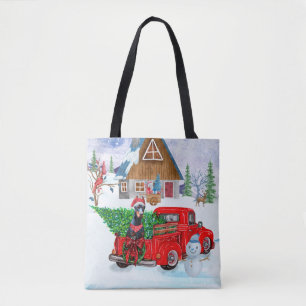 Doberman Dog in Christmas Delivery LKW Schnee Tasche