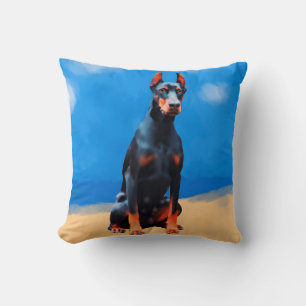 Doberman Hund sitzt am Strand Kissen