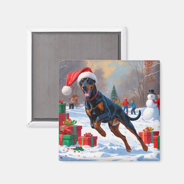 Doberman läuft im Schnee mit Weihnachtshut Magnet (Vorderseite/Rückseite)