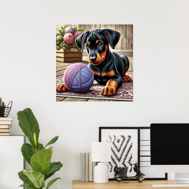 Doberman Puppy mit Garnball auf einem farbenfrohen Poster (Heimbüro)