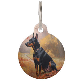 Dobermann im Herbst inspiriert durch fallende Blät Haustiermarke