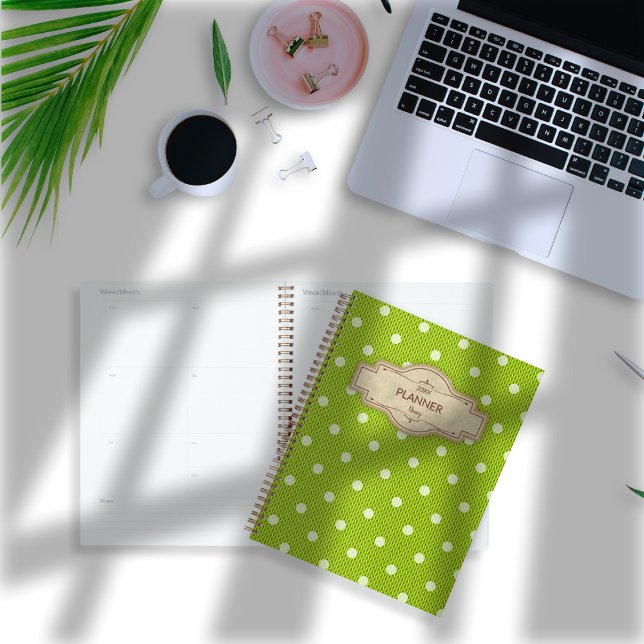 Dotty Delight Green Planer (Dotty Delight Green Planner on the desk. )