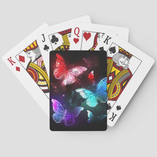 Drei glühende Schmetterlinge im Hintergrund Spielkarten (Rückseite)