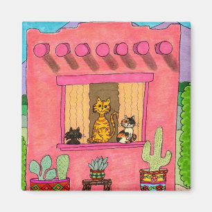 Drei Katzen in einem rosa Adobe-Haus Magnet