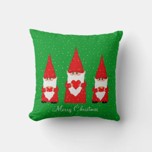 Drei Weihnachtsgnome auf Grün Kissen