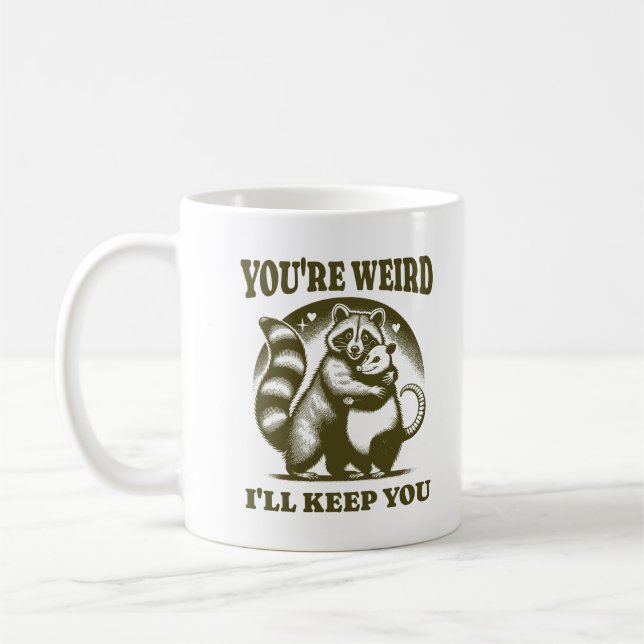 Du bist seltsam, ich behalte dich lustiger Waschbä Kaffeetasse (Links)