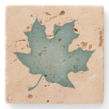 Dunkeltürkisfarbenes Leaf auf Creme