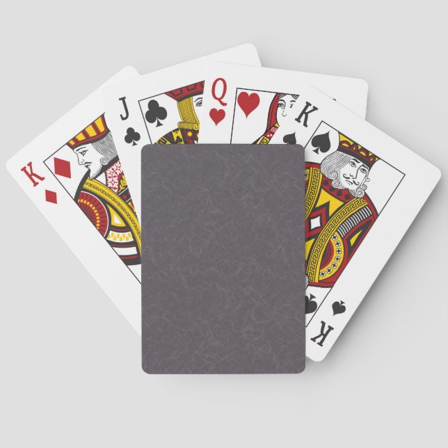 Dunkle violette texturierte Oberfläche mit wirbeln Spielkarten (Rückseite)