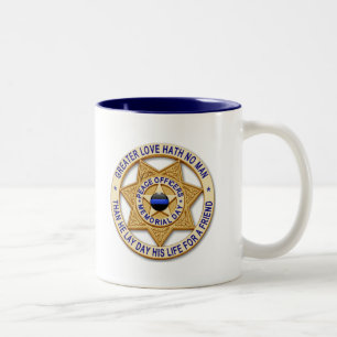 Dünne blaue Linie - glühende Schaltfläche und Gold Zweifarbige Tasse
